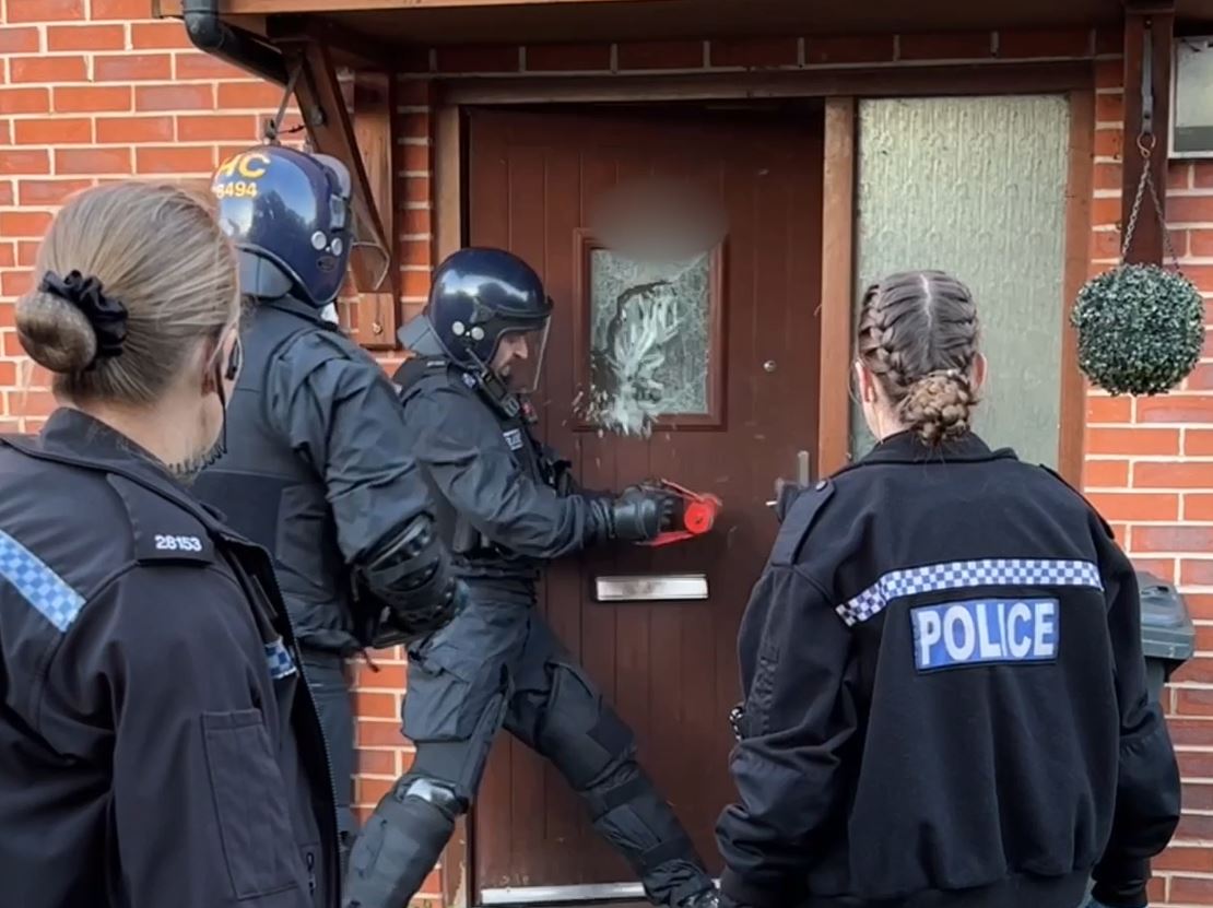 Officers carrying out a warrant in Basingstoke